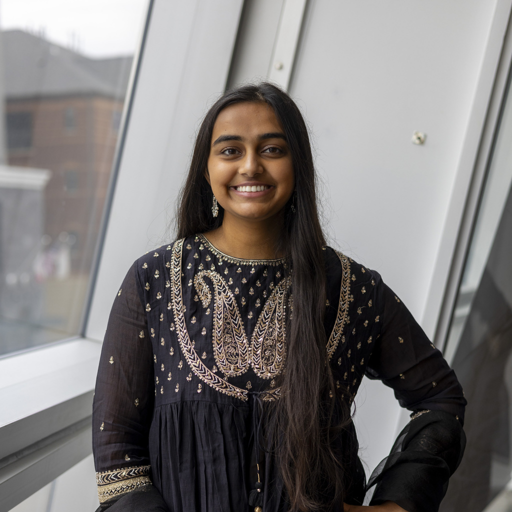 Sanjna smiling at camera