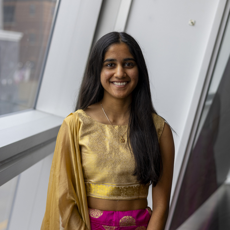 Amya Saxena smiling at the camera
