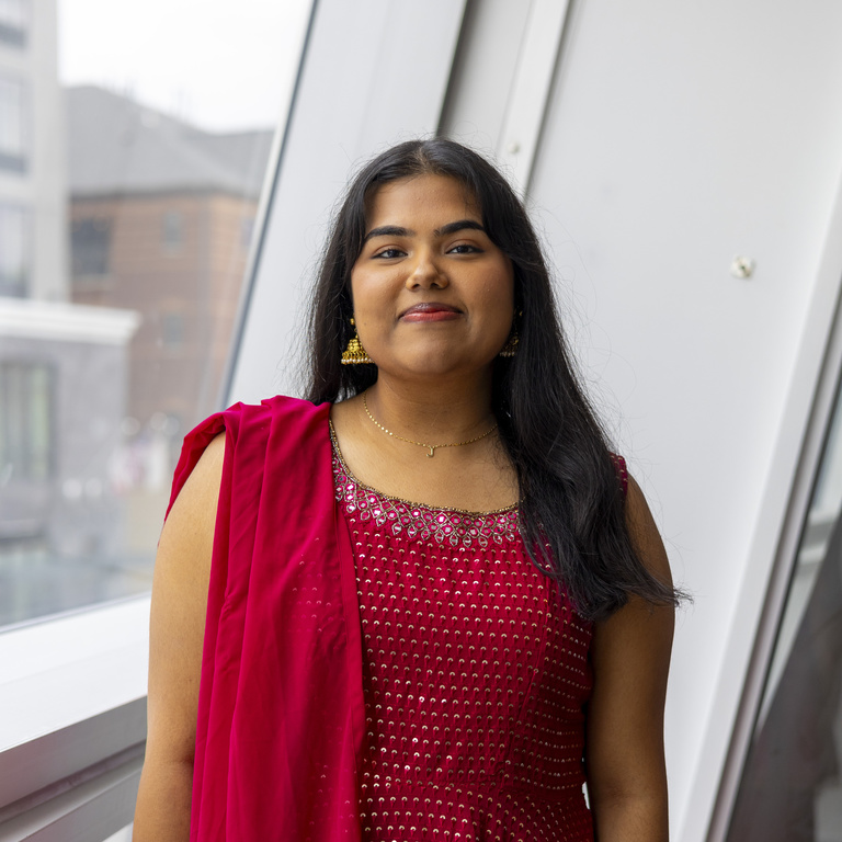Jahanvi Chawla smiling at camera