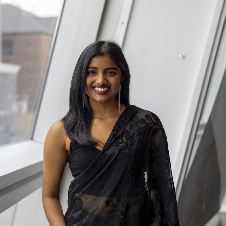 Nandana Menon smiling at the camera