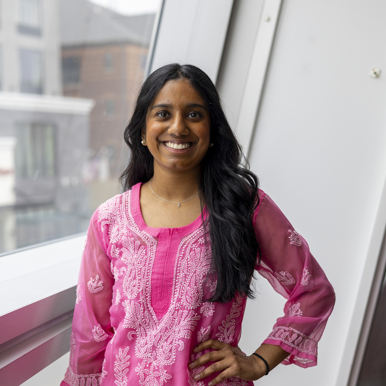 Puja Mekala smiling at the camera