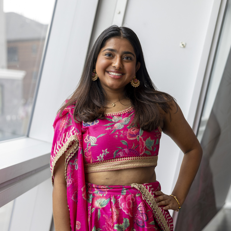 Rupika smiling at camera