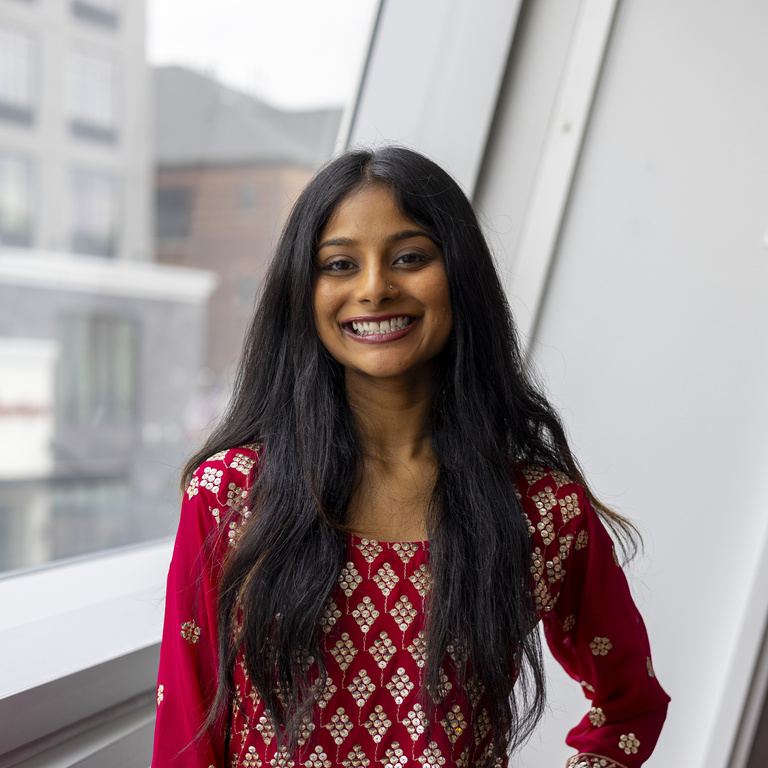 Sneha Sarvanan smiling at the camera