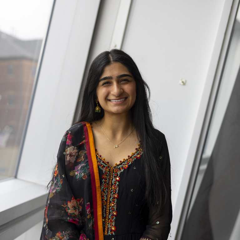 Srushti Chaudari smiling at the camera