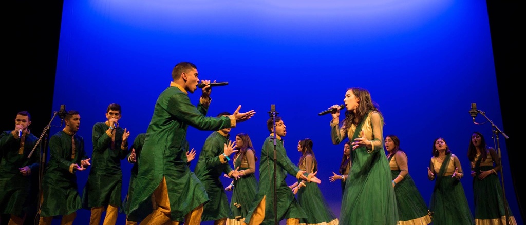 People dancing and singing on stage